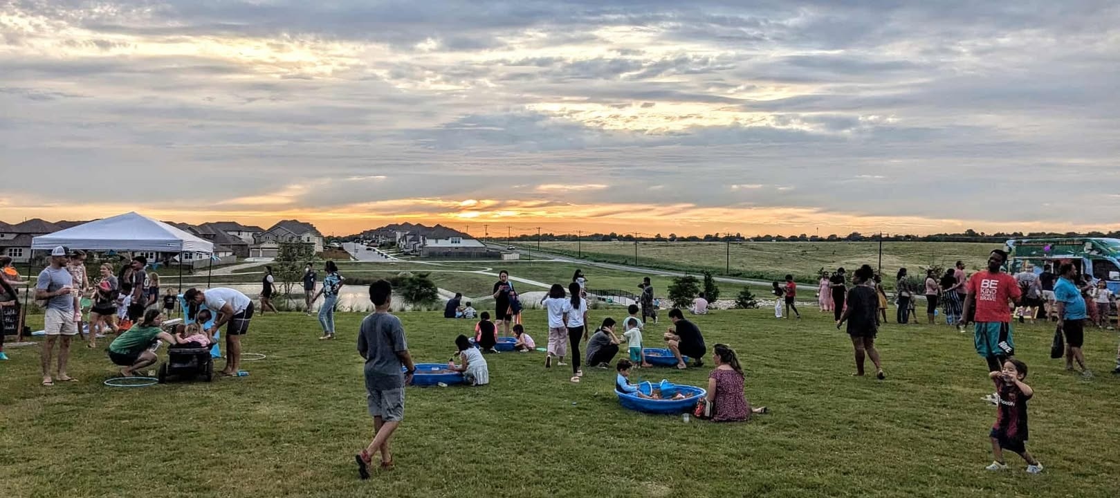 Residents gathered outdoors at a Blackhawk community event.