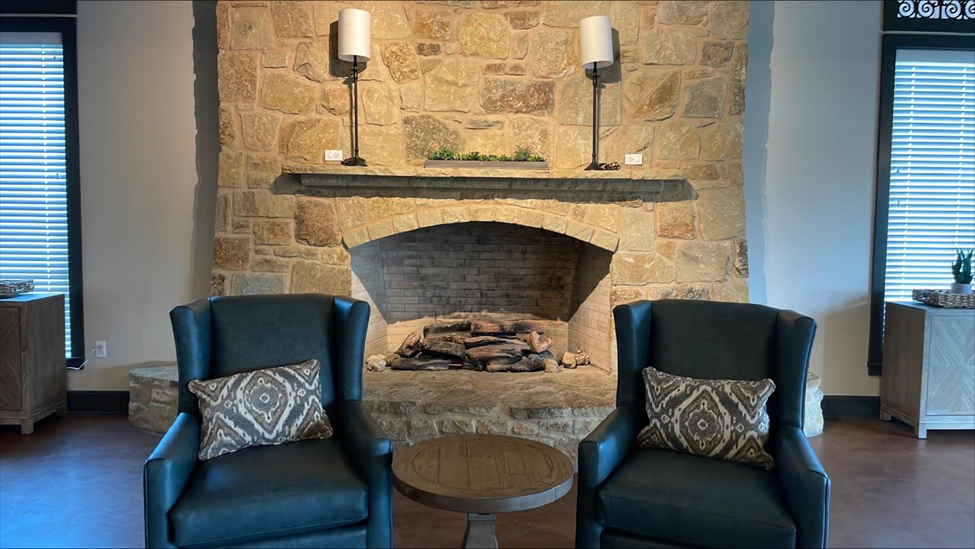 Standard furniture arrangement in front of the clubhouse fireplace.